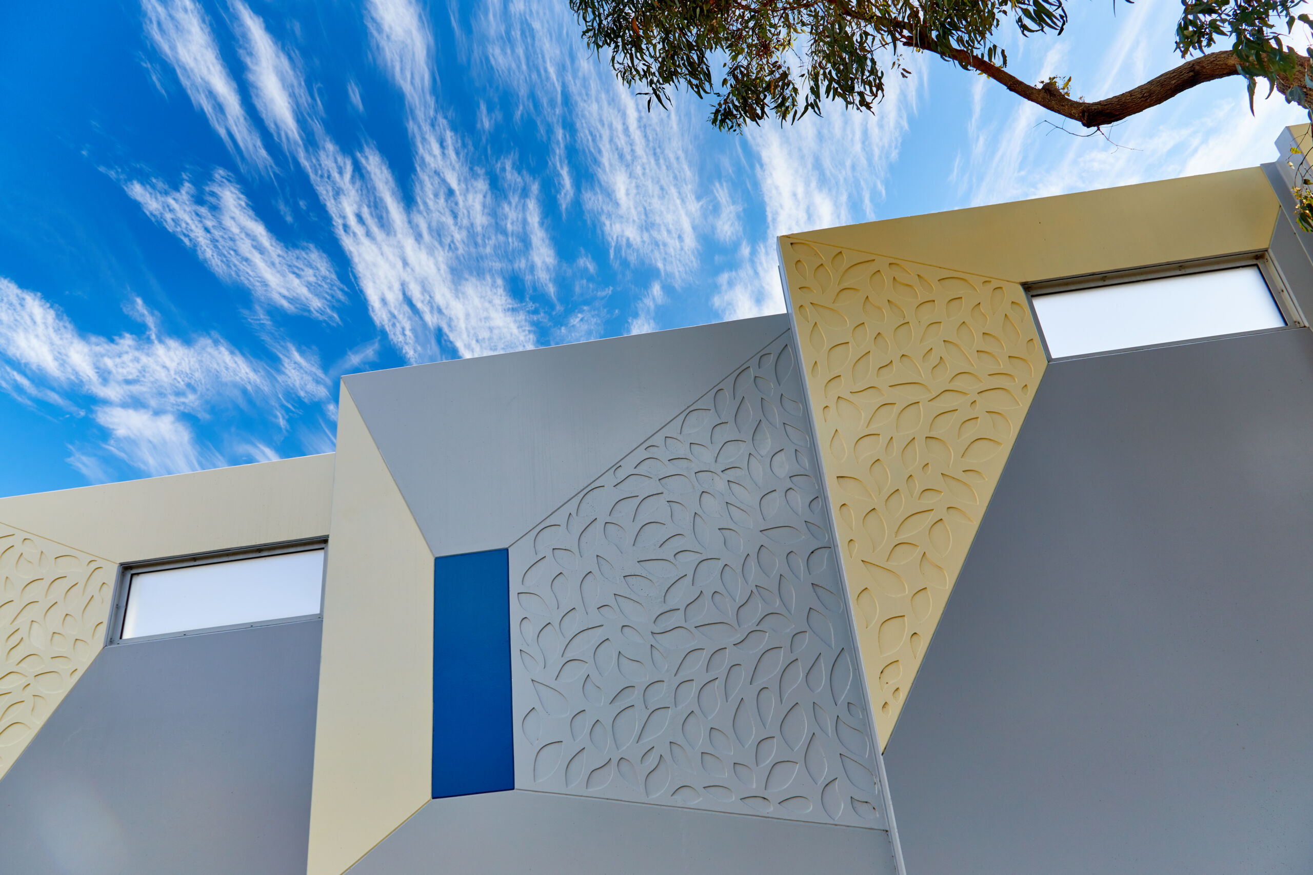 A reinforced earth wall (MSE wall) at the Sydney Gateway project, New South Wales, which has pre cast concrete facing panels with decorative elements engraved.