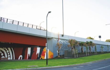 Ovingham Level Crossing Removal Project, completed reinforced earth precast walls by Reinforced Earth Company, known as TechWall, forms the backdrop for local First Nations artworks.