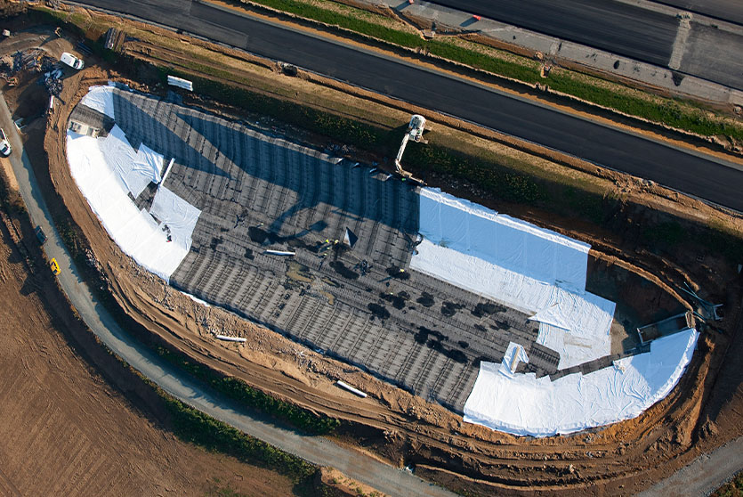 The geotextile, TechRevetment™ formed concrete mattresses, part of the geosynthetics solutions for erosion control. Pictured on a steep slope at a mine site.