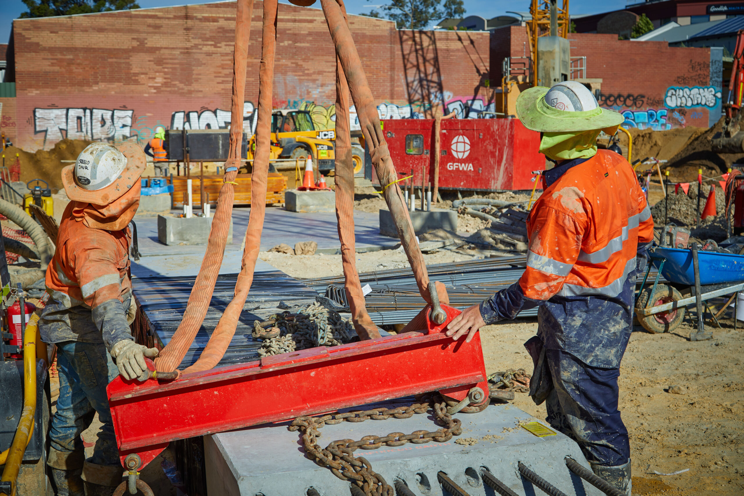 A reinforced earth wall (MSE wall) at the Sydney Gateway project, New South Wales, which has pre cast concrete facing panels with decorative elements engraved.